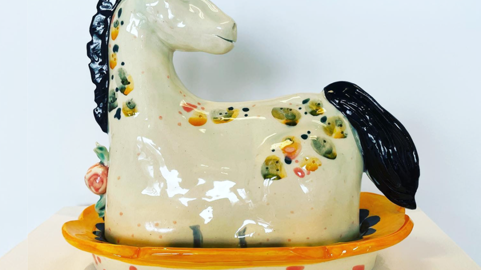 Art market featuring decorative horse sculpture