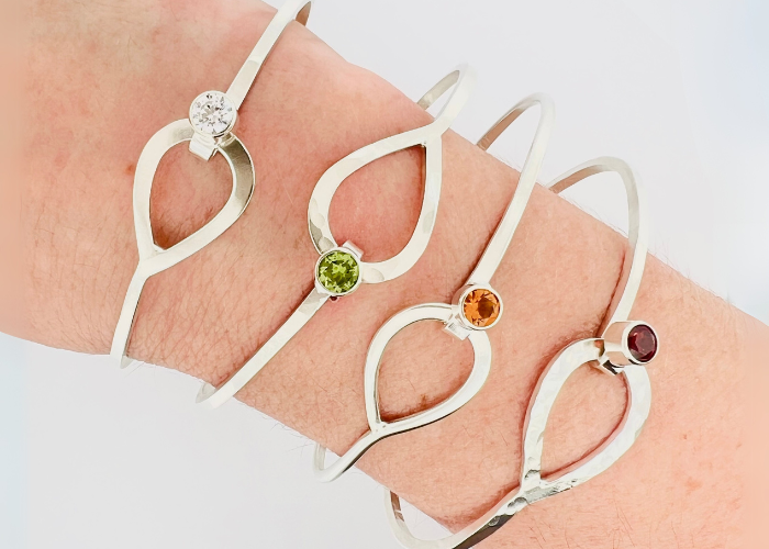 Four elegant silver hook bracelets