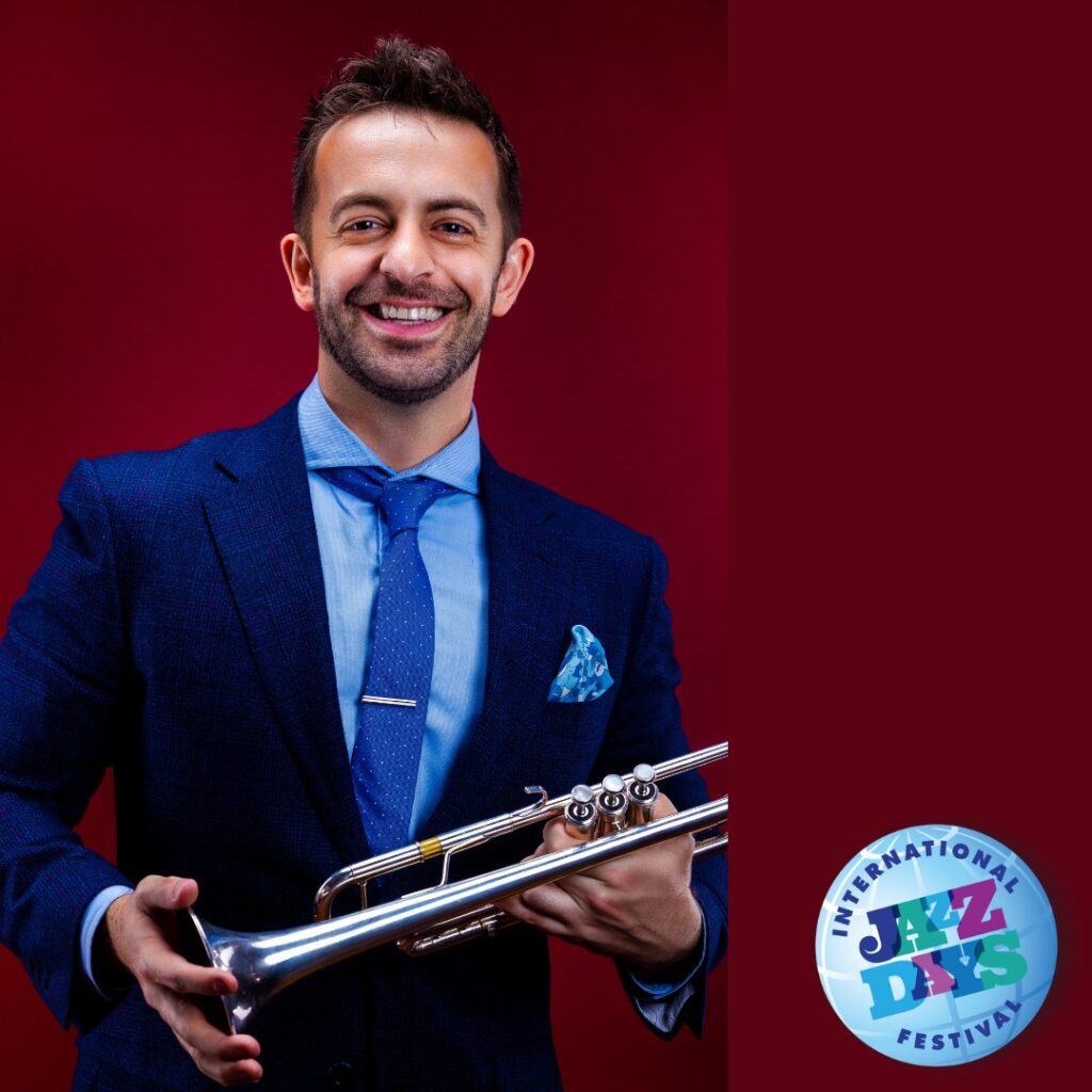 Musician holding a trumpet, festival.