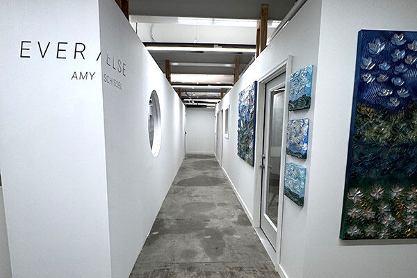 Art gallery hallway with paintings