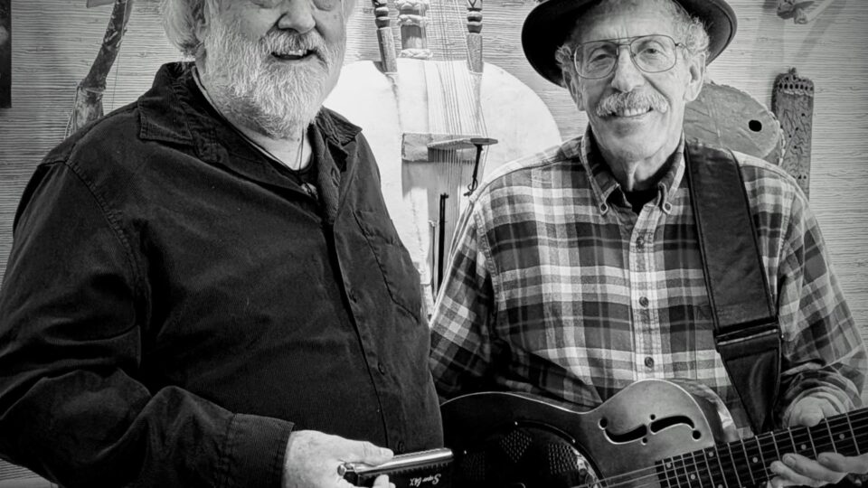 Two musicians with instruments in studio