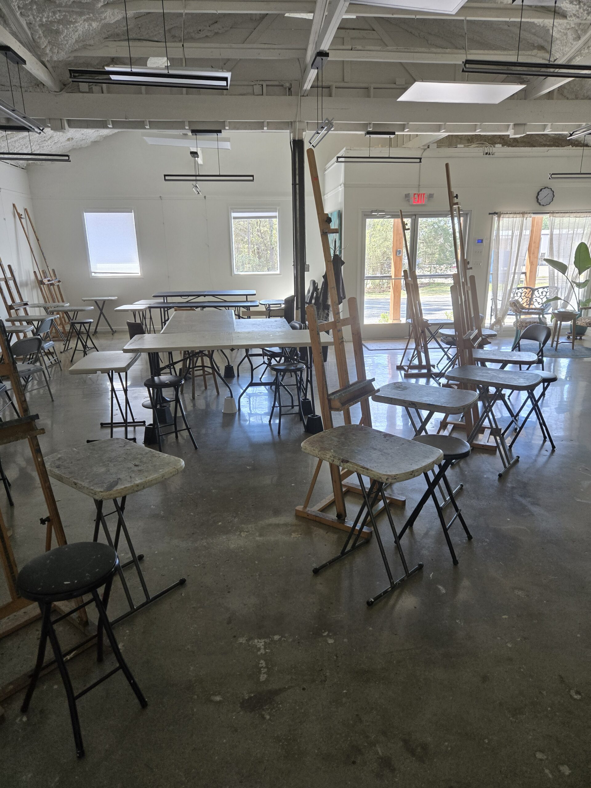 Empty art studio with easels and tables