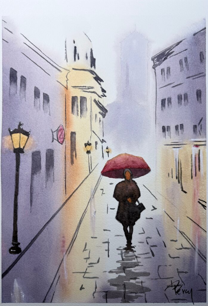 Person with umbrella walking in rain