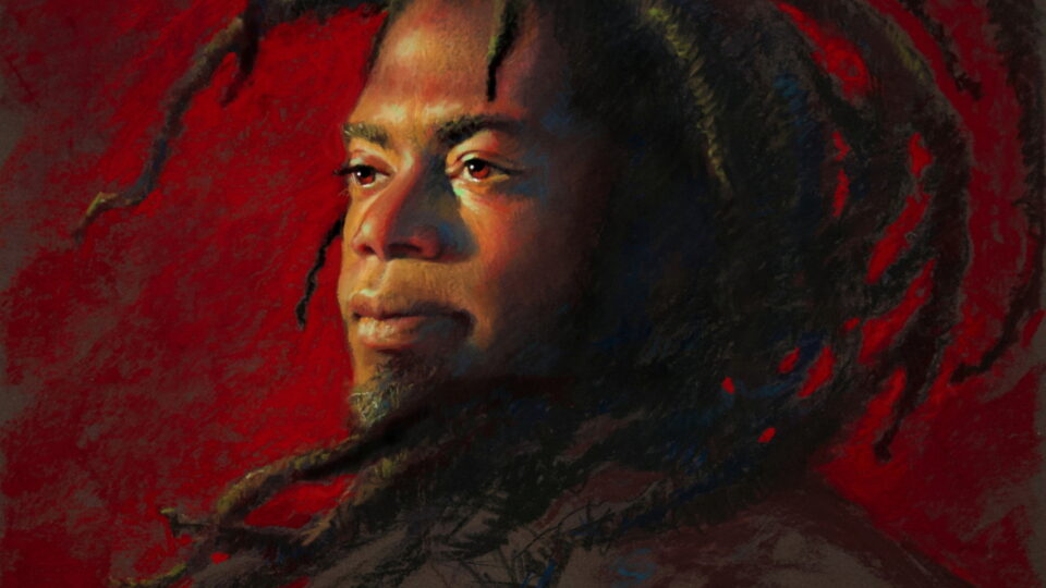 Portrait of a man with dreadlocks.