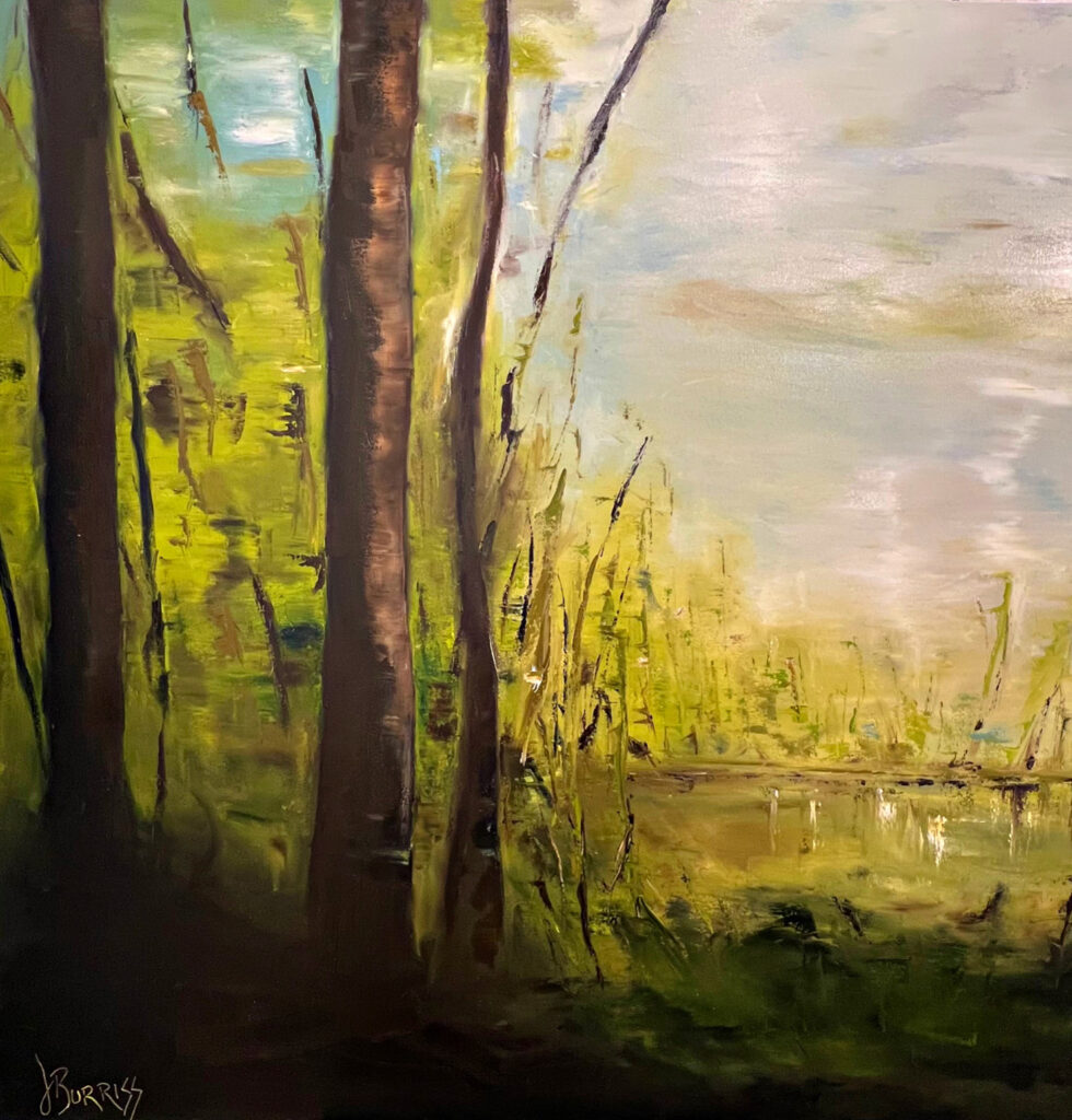 Lush forest with serene water reflection