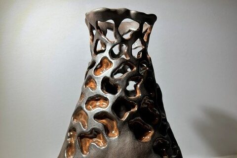 Artistic ceramic vase with holes