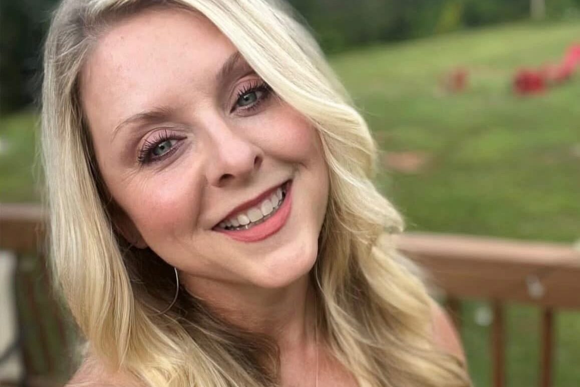 Smiling woman with long blonde hair