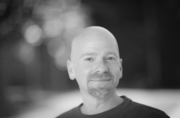 Smiling bald man in soft focus