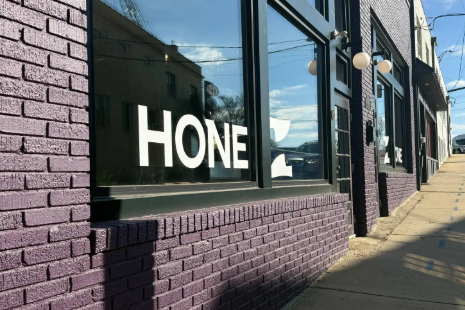 Purple brick building with large window
