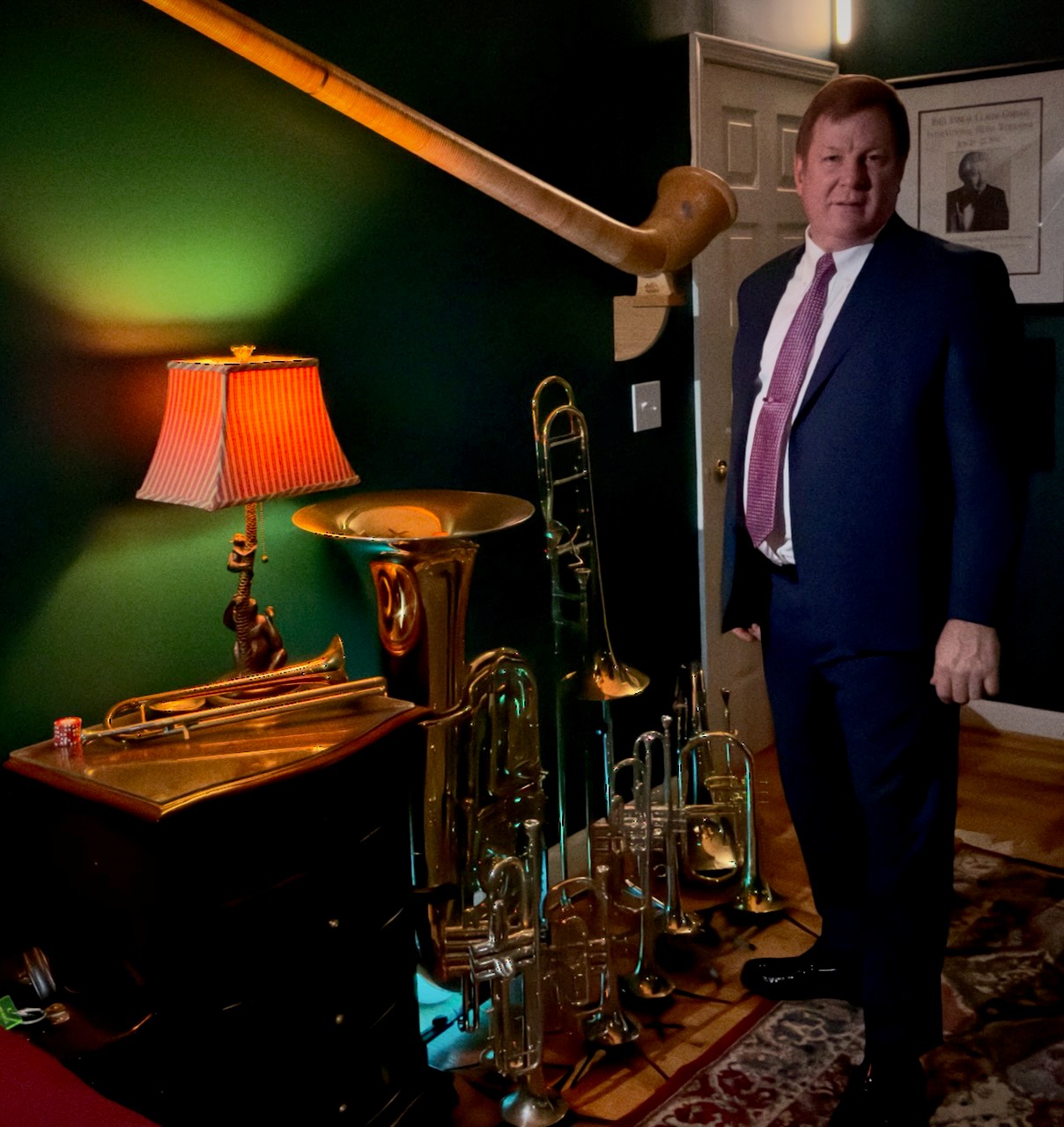 Man standing near musical instruments.