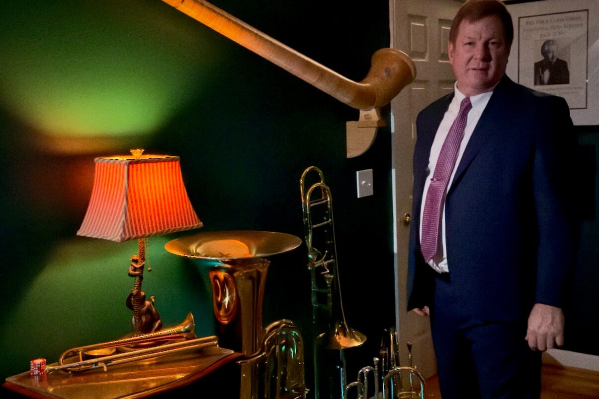 Man standing near musical instruments.