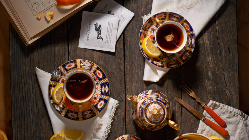 Tea set with lemons and pastries.