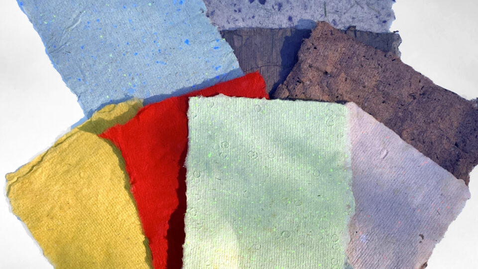 Colorful handmade paper sheets stacked