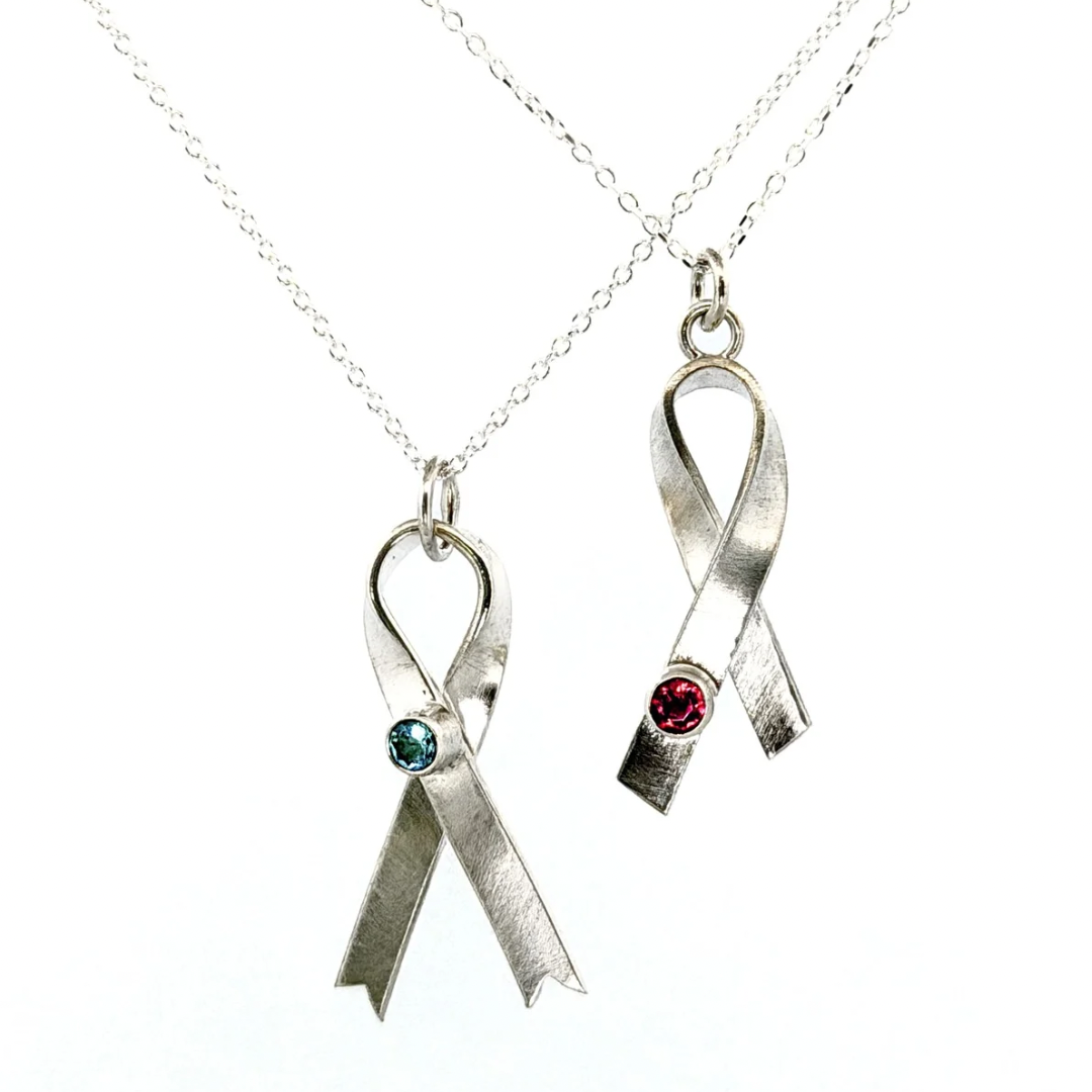 Two silver ribbon necklaces with gems