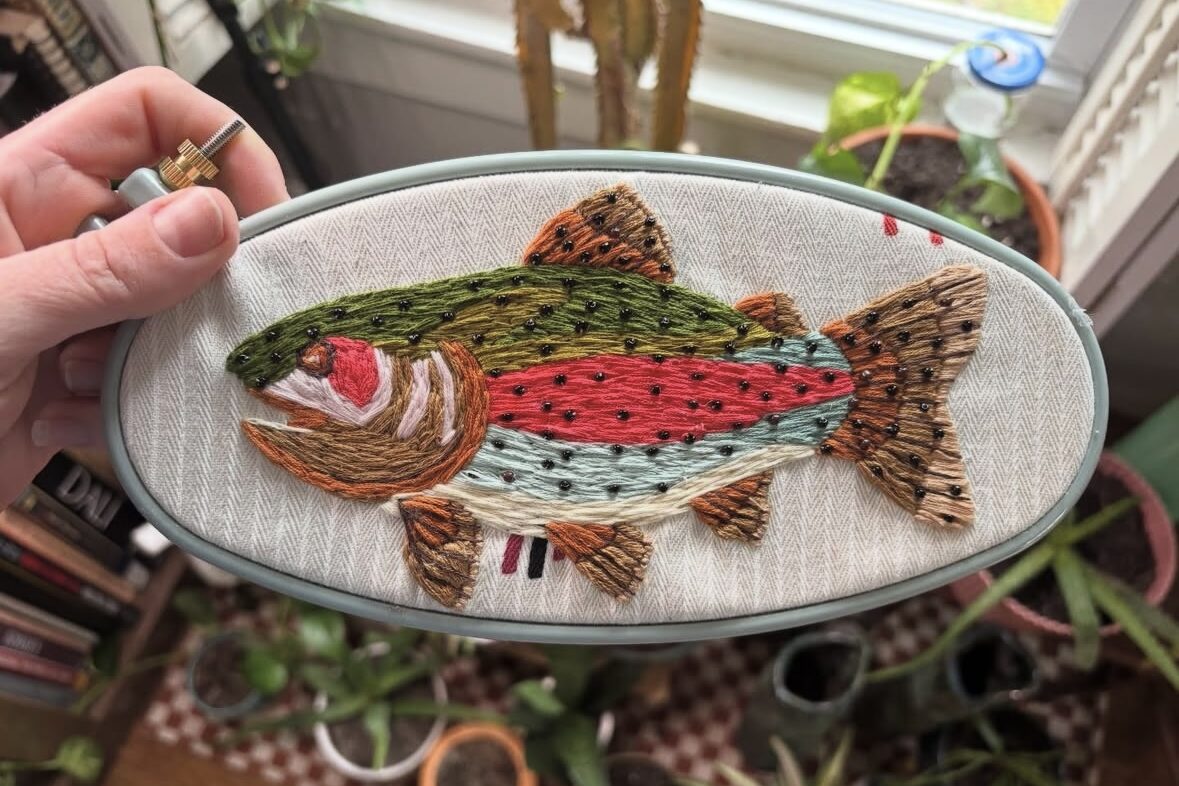 Colorful embroidered fish artwork