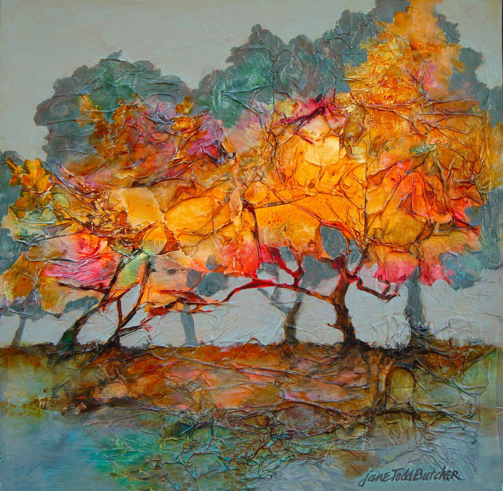 Colorful autumn trees by water