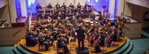 a orchestra with a conductor