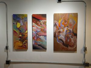 a group of art pieces on a wall