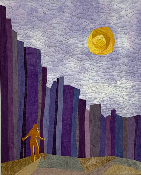 a quilted art piece of a man walking on a bridge