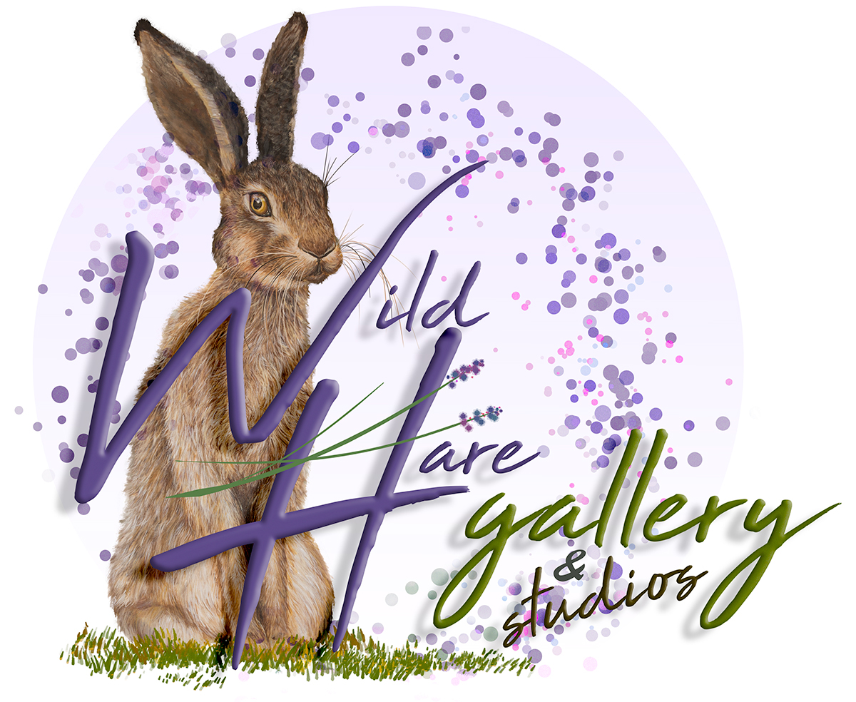 a rabbit sitting on grass with purple text