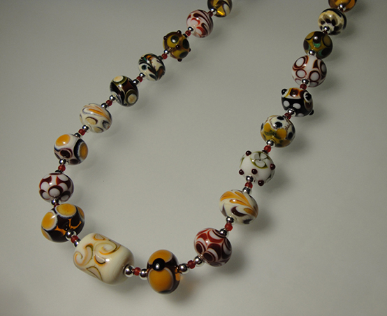 Handmade glass beads, sterling, crystal
20 inches long
