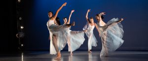 a group of women dancing on a stage
