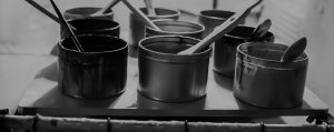 a group of cans with paint on them