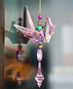 a origami bird from a window