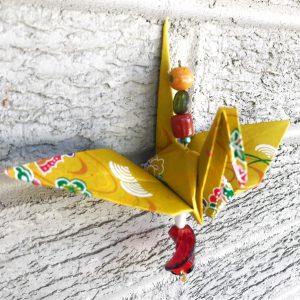 a yellow origami crane