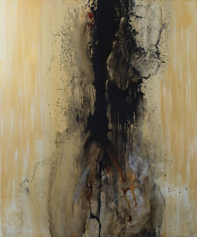 a black and tan paint splattered on a tan surface
