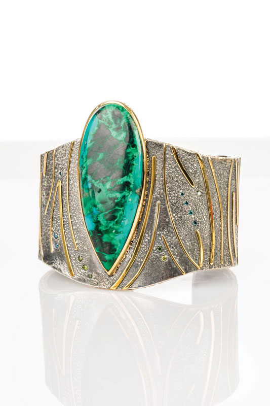 Sterling silver, 18k yellow
gold, 22k gold, 24k gold, malachite/
chrysocolla, blue and green
sapphires
3 x 2 x 2.5 inches