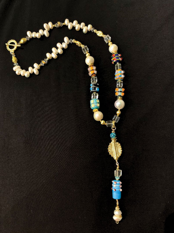 Large lampwork glass
beads, freshwater pearls, gold metal
and crystal
24 inch necklace with 4.5 inch pendant