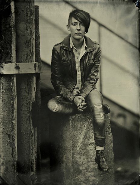 a person sitting on a rock