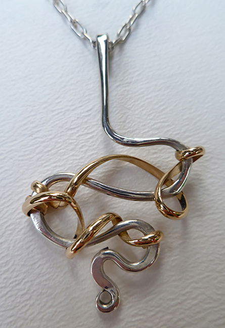 Sterling silver and gold, on a sterling silver chain
2 x .5 inches
