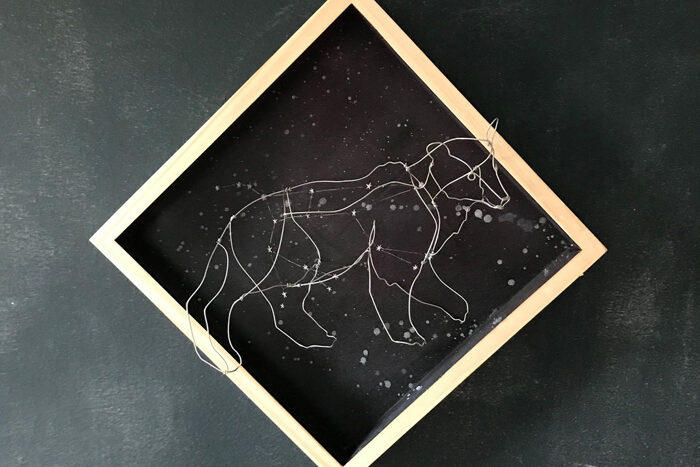 a wire art of a bear