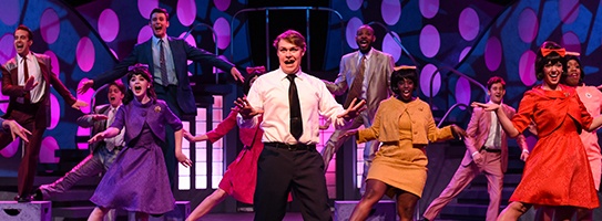 a group of people on stage